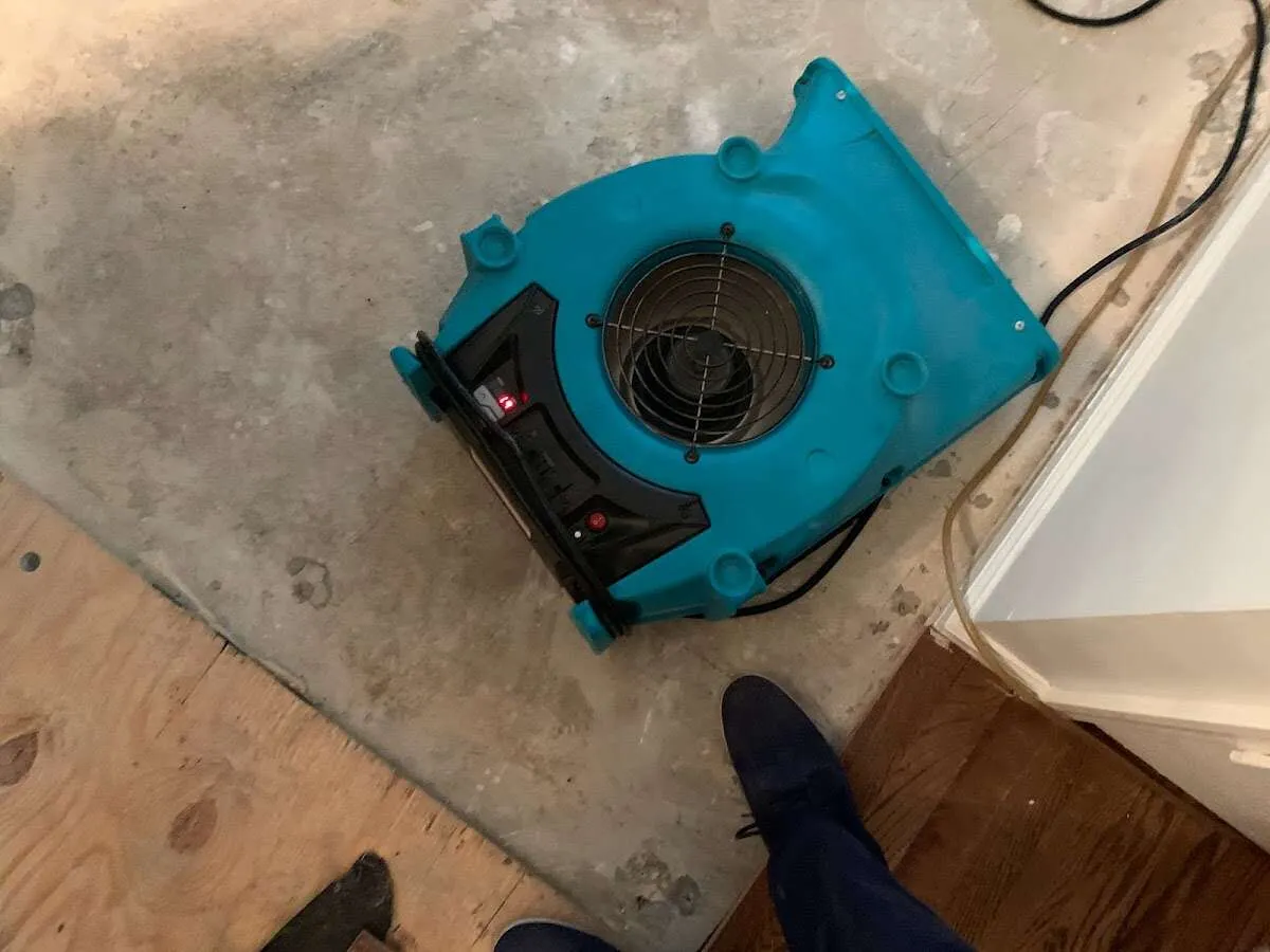 Air mover drying subfloor during Leak Detection & Repair in Incline Village
